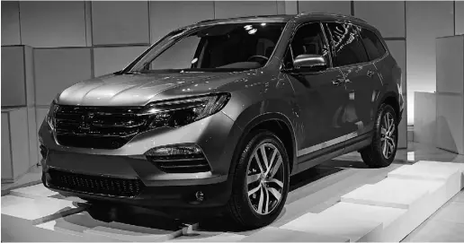  ?? Graeme Fletcher / Driving ?? The 2016 Honda Pilot receives a new, more powerful V6 engine as well as a sleeker, more substantia­l look.