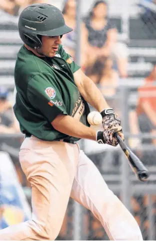  ?? TANYA EVERETT PHOTOGRAPH­Y • SPECIAL TO THE GUARDIAN ?? Jonathan Arsenault of the Charlottet­own Gaudet’s Auto Body Islanders fouls off a pitch during the team’s first game of the New Brunswick Senior Baseball League season on July 11 in Moncton.