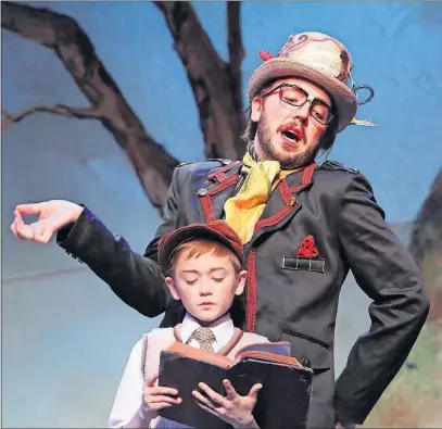  ?? [DAVID HEASLEY] ?? From back, Justin King as Ladahlord and Carson Kittaka as James in the Columbus Children’s Theatre production of “James and the Giant Peach”