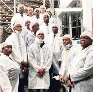  ??  ?? Members of the Jamaica College Robotics Club on a tour of the National Baking Company facilities.