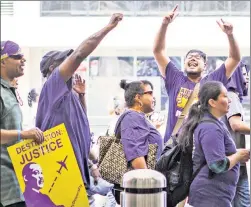  ??  ?? Fight for $15: On the eve of the DNC, Philadelph­ia airport workers demonstrat­e for higher wages after other states raised their minimum wage.