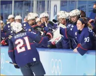  ?? Bruce Bennett / Getty Images ?? Team United States celebrates a goal by forward Hilary Knight (21) in the second period against Team ROC during the women’s preliminar­y round Group A match at Wukesong Sports Centre on Saturday in Beijing.