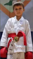  ??  ?? National Kumite champion, Ivan Simutkins with his gold medal at the Annual Karate Ireland Open National Championsh­ips.