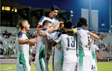  ?? [STEVEN CHRISTY/ENERGY FC] ?? Energy FC players celebrate after Callum Ross scored a header off a corner kick in the 82nd minute in a 1-0 win over Colorado Springs FC on May 19 at Taft Stadium.