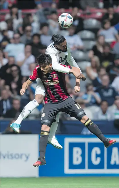  ?? — THE CANADIAN PRESS ?? Atlanta’s Yamil Asad and Vancouver’s Sheanon Williams vie for the ball during the second half of Saturday’s showdown in Vancouver.