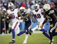 ?? JAE C. HONG — THE ASSOCIATED PRESS FILE ?? In this Nov. 19photo, Buffalo Bills quarterbac­k Tyrod Taylor runs against the Los Angeles Chargers during the second half of an NFL football game in Carson The Bills and Chiefs have been riding a similar rollercoas­ter this season. They both started hot...