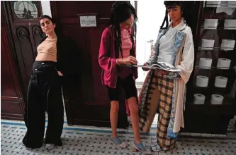  ??  ?? Models present creations by Sirloin during the women’s Fall-Winter 2017-2018 ready-to-wear collection fashion show at the Madeleine’s historical public toilets in Paris.