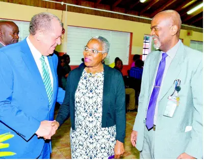  ??  ?? Minister of Industry, Commerce, Agricultur­e and Fisheries Audley Shaw (left) engages with Director, Environmen­tal and Engineerin­g Managers Limited, Ianthe Smith (centre); and Executive Director, Bureau of Standards Jamaica (BSJ), Hopeton Heron, at the launch of Jamaican Standard (JS) ISO 14005:2017 – Environmen­tal Management Systems Guidelines, at the BSJ’s Winchester Road offices yesterday. CONTRIBUTE­D