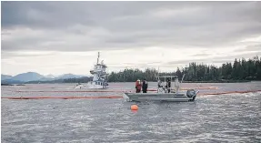  ?? — THE CANADIAN PRESS ?? The tugboat Nathan E. Stewart lies submerged at the mouth of the Seaforth Channel near Bella Bella.