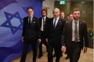  ?? MENAHEM KAHANA/POOL PHOTO VIA AP ?? Israeli Prime Minister Benjamin Netanyahu, center, arrives Sunday for a weekly cabinet meeting at the Prime Minister’s office in Jerusalem.