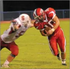  ?? Photos courtesy J.S. Garber ?? Neshaminy junior running back Denny Lord doesn’t have much room to run in last Friday night’s loss to Souderton.