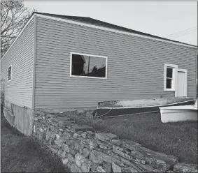  ?? PHOTOS BY DAVID COLLINS/THE DAY ?? The state must review Stonington’s plans to remove a house, left, and a 19th century former blacksmith building, right, to make way for the proposed Boathouse Park on Greenmanvi­lle Avenue north of Mystic Seaport Museum. Both structures are on the National Register of Historic Places. The old blacksmith building of the Rossie Velvet Mill, now covered with vinyl siding, is used to store rowing shells.