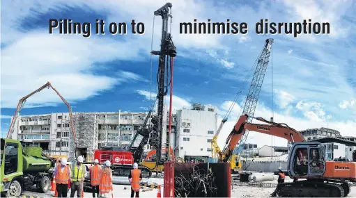  ?? PHOTOS: PETER MCINTOSH ?? Options . . . March Constructi­on workers prepare for a test pile to be drilled at the new Dunedin Hospital site yesterday. Below: Workers drill the first pile.