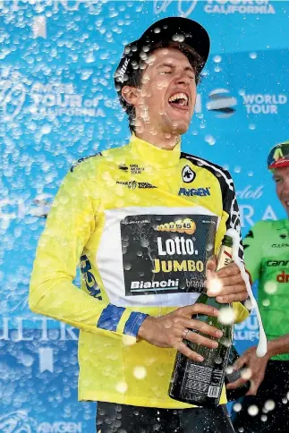  ?? GETTY IMAGES ?? George Bennett celebrates with champagne after winning the Tour of California last weekend.