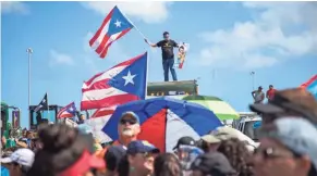  ??  ?? Thousands of Puerto Ricans gather Monday in San Juan for one of the biggest protests ever seen in the U.S. territory.