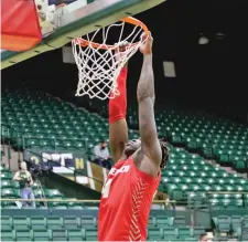  ??  ?? Lobos sophomore Emmanual Kuac was the only scholarshi­p player not in the starting lineup for Wednesday’s regular season finale at Colorado State. With a depleted roster that forced four walk-ons into the lineup, UNM was beaten 87-73 by the Rams.