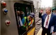  ?? LANE TURNER/GLOBE STAFF ?? T general manager Phillip Eng chatted with a Blue Line train driver at Wonderland.