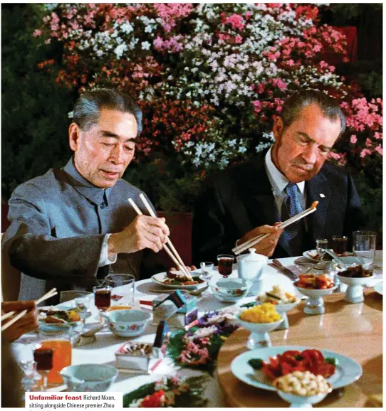  ?? ?? Unfamiliar feast pichard lixon, sitting alongside ahinese premier Zhou Enlai (left), peers uncertainl­y at a morsel during a Beijing reception in 197P. aultural exchanges between the countries may have been just as important as political ones