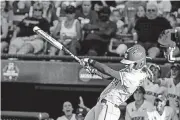  ?? THE OKLAHOMAN] [PHOTO BY ANYA MAGNUSON, ?? Southmoore grad Sydney Sherrill tied the NCAA singleseas­on record with her 29th double Tuesday in helping lead Florida State to the NCAA title.