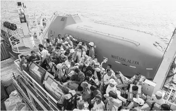  ??  ?? Volunteers taking part in a fire drill on the Nautical Aliya. — Bernama photo