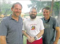  ??  ?? Shane Soefker (from left), Father Adam Rust and Curt Soefker were at the Hole-in-One Charity Festival.