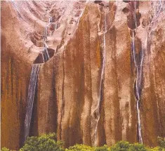  ??  ?? Rain waterfalls on Uluru by @chaseolear­yphoto received 7100 likes