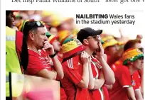  ?? ?? NAILBITING Wales fans in the stadium yesterday