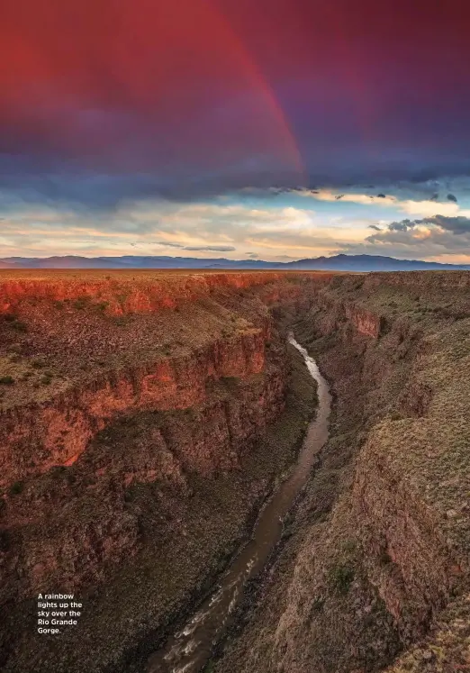  ??  ?? A rainbow lights up the sky over the Rio Grande Gorge.