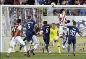  ?? GERRY BROOME — THE ASSOCIATED PRESS ?? United States goalie Zack Steffen (12) defends with DeAndre Yedlin (2) and Wil Trapp (20) against Paraguay’s Federico Santander during the first half Tuesday in Cary, N.C.