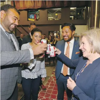  ?? JIM WELLS ?? Premier Rachel Notley joins, from left, Ravinder Minhas, co-founder and CEO of Minhas Breweries & Distillery, Manjit Minhas, co-founder of Minhas Breweries, Distillery and Winery, and Ricardo Miranda, the province’s minister of culture and tourism...