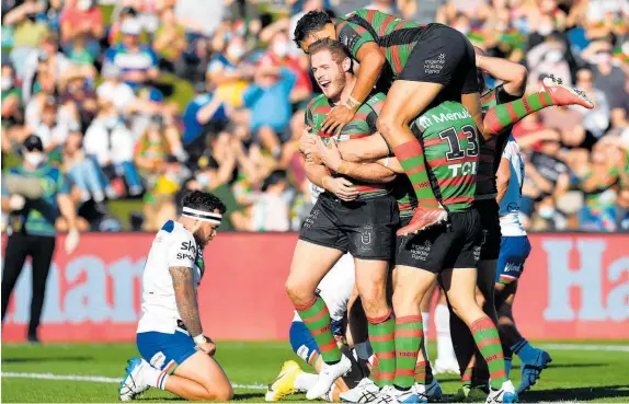  ?? Photo / Photosport ?? The Warriors couldn’t cope with Tom Burgess close to the line, as his early tries helped set up a convincing South Sydney win.