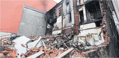  ?? RICHARD LAUTENS TORONTO STAR FILE PHOTO ?? A portion of the back of the Peacock Hotel had collapsed following an earlier fire at the heritage building last August.