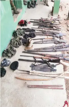  ??  ?? Some of the weapons reportedly recovered during a raid on two communitie­s in Agatu LGA of Benue State by the military.