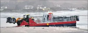  ??  ?? Waste to go: the bins are emptied on the Isle of Luing on Tuesday.