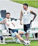  ?? ?? Time-out: Declan Rice (top) has fun at England training; Lionel Messi (above) takes a break with Argentina