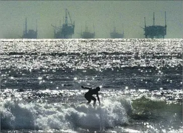  ?? Lawrence K. Ho Los Angeles Times ?? CALIFORNIA’S ENTIRE Pacific coast and its lakes, rivers and inlets all fall under the State Lands Commission, which oversees shipping, fishing, oil and gas wells and more. Above, oil rigs in the Santa Barbara Channel.