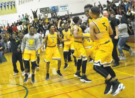  ?? D. Ross Cameron / Special to The Chronicle ?? Mission players exult after beating host Vanden-Fairfield 72-68 in Saturday’s Northern California Division 3 title game.
