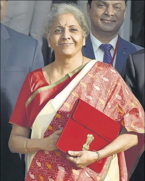  ?? AJAY AGGARWAL /HT PHOTO ?? Finance minister Nirmala Sitharaman with officials before presenting the Union Budget in New Delhi on Monday.