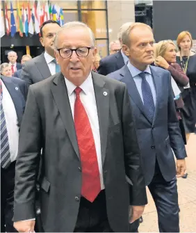  ??  ?? Power players European Commission President Jean-Claude Juncker (left) and European Council President Donald Tusk following the agreement by EU member state leaders of the Brexit deal