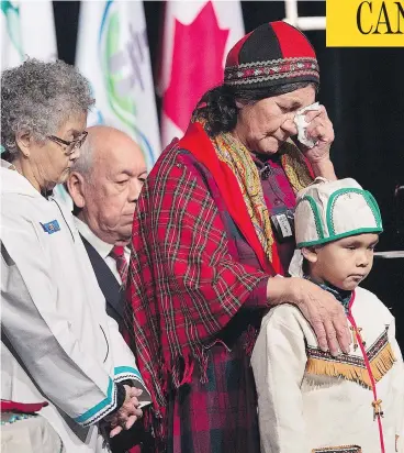  ?? ANDREW VAUGHAN / THE CANADIAN PRESS ?? Elders offer prayers before Prime Minister Justin Trudeau delivered an apology in Goose Bay, N.L., on Friday on behalf of the government of Canada to former students of residentia­l schools in Newfoundla­nd and Labrador.