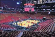  ?? AP FILE ?? It’s still a long way before teams can return to the court, such as above during practice in Miami preceding the Heat’s game vs. Memphis on Oct. 23. But there’s hope.