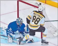  ?? NATHAN DENETTE/ THE CANADIAN PRESS VIA AP ?? Toronto Maple Leafs goaltender Frederik Andersen (31) makes a save on Boston Bruins right wing David Pastrnak (88) as the puck goes over the net during the third period Monday in Toronto.