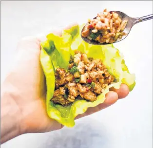  ?? AMERICA’S TEST KITCHEN VIA AP ?? This undated photo provided by America’s Test Kitchen in December 2018 shows an Asian Chicken Lettuce Wrap in Brookline, Mass. This recipe appears in the cookbook “The Complete Diabetes Cookbook.”