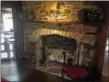  ??  ?? Log house kitchen fireplace