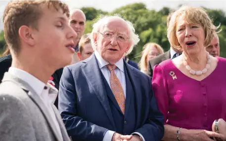  ??  ?? President Michael D Higgins and his wife Sabina listen to a song by Bernard Lawrence, from Castlebar, at the National Museum of Ireland – Country Life, in Turlough, Co Mayo, where he officially opened a temporary exhibition named Travellers’ Journey which is exploring the rich culture of the Traveller community in the west of Ireland. Photo: Keith Heneghan