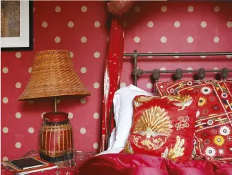  ??  ?? FROM LEFT ‘The Red Bedroom’ was inspired by the colours of north India; Raffa was drawn to this wallpaper because it reminds her of the Blue City in Morocco; the yellow walls of the master bedroom are contrasted with accents of red, provided by the curtains.