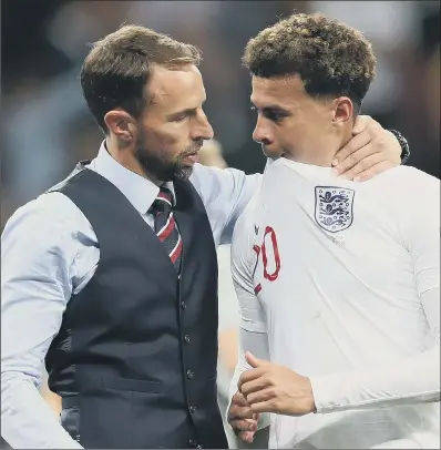  ?? PICTURE: IAN MACNICOL/GETTY IMAGES ?? NOT OUR TIME: Gareth Southgate consoles England midfielder Dele Alli following their semi-final defeat to Croatia.