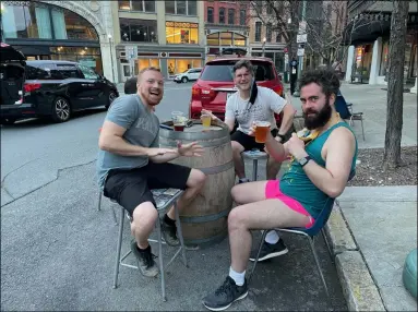  ?? PHOTO PROVIDED ?? Customers of 518 Craft enjoy drinking craft beer outside on a warm early spring day. The business recently applied for a permit to use parking spots in front of its establishm­ent as extra outdoor seating space for the 2021 season.