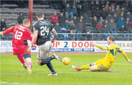  ??  ?? Dundee’s lowest point of the season: Chris Kane makes it 4-0 to St Johnstone at Dens Park last month.