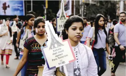  ??  ?? KOLKATA: Indian youth march in a silent rally to protest against Friday’s Paris attacks, in Kolkata, India yesterday. Multiple attacks across Paris on Friday night have left more than one hundred dead and many more injured. — AP